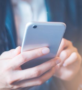 Woman holding cell phone